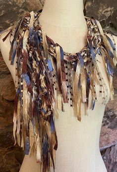 Western scarf for women. Browns, tan and denim blue ribbon with gold metallic in same colors for sparkle. Great accessory idea for rodeos, western themed events or fun country night out. Goes well with jeans and just white T-shirt or with tan, brown and jean's blue tops and of course denim jacket or use it as a hat band on your cowboy hat.  This is traditional scarf, about 70" long. Hand wash in lukewarm water with mild soap, don't rub or wring, squeeze of excess water and hang to dry.  Comes with nice organza satchel for traveling, storage or gift giving. Store the ribbon scarves flat in a drawer or hang them up.  Handmade in United States of America.  Visit my store front at  www.Etsy.com/shop/thinkerbella for more color and design options.  Colors may vary slightly due to different moni Cowgirl Scarf, Country Night, Western Scarf, Avatar Cosplay, Cowgirl Accessories, Western Gifts, Cowgirl Rodeo, Scarf Necklace, Western Jacket