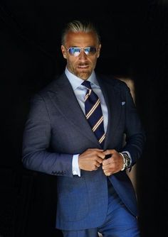 Made from a rare year-round tick-weave wool, this Milano cut three-piece suit features a double-breasted waistcoat, along with our signature one-button placement, double vents, patch pockets, natural shoulder, and wide peak lapels. The accompanying slim trousers are flat front with a wide waistband and feature our vers Christopher Korey, Blue Tick, Older Mens Fashion, Evening Suit, Vest And Pants, Double Breasted Waistcoat, Suit For Men, Jacket Shirt