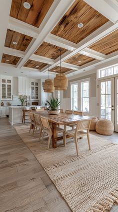 a large dining room with wooden ceiling beams