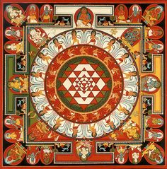 an intricately designed painting with many different colors and designs on the surface, including symbols