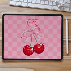 a computer mouse pad with an image of two cherries on it and the number eight