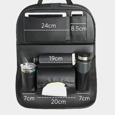 the back side of a black backpack with two compartments and one compartment that is filled with items