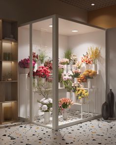 a room filled with lots of different types of flowers