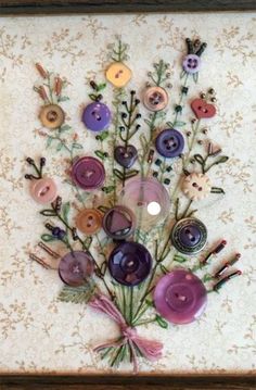 a painting with buttons and flowers on it