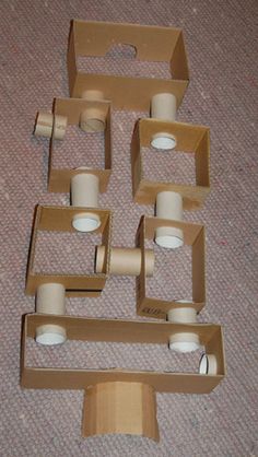 several rolls of toilet paper sitting in boxes on the floor