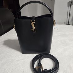 Authentic Black Smooth Leather Measures 6.7x9.1x3.5 Inches New, Store Display, Feet Have Minor Wear, Very Faint Scratches Due To Store Handling And Type Of Leather Check Out My Other Listings Bags Ysl, Small Bucket Bag, Ysl Saint Laurent, Small Buckets, Yves Saint Laurent Bags, Store Display, Ysl Bag, Smooth Leather, Bucket Bag