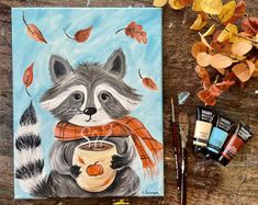 an acrylic painting of a raccoon holding a cup of coffee with autumn leaves surrounding it