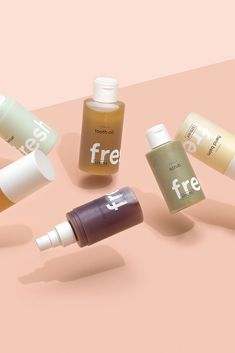 five different types of skin care products on a pink background with the word free written in white