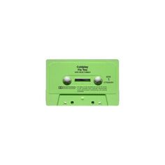 a green cassette player sitting on top of a white wall