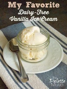 a bowl of vanilla ice cream sitting on top of a white plate