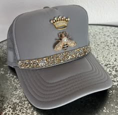 Gray trucker hat with rhinestone crown, bee and bling trim.  Please message me if you like a different color hat, trim or embellishment and I'll be happy to make one you like best! Bedazzled Trucker Hat, Socks And Jeans, Casual Brunch Outfit, Swag Hats, Fashion Trend Inspiration, Happy Hat, Dope Hats, Rhinestone Crown, Diy Hat