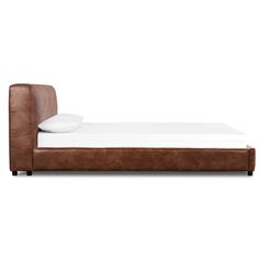 a brown leather bed frame with white pillows on the top and bottom end, in front of a white background