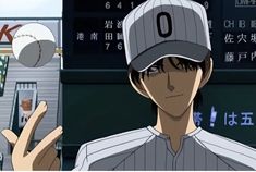 a baseball player is holding up his peace sign