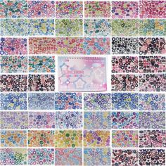 many different colored stickers are arranged in rows on a white background, including one with stars and the other with circles