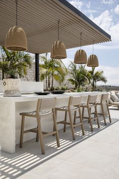 an outdoor dining area with chairs and tables