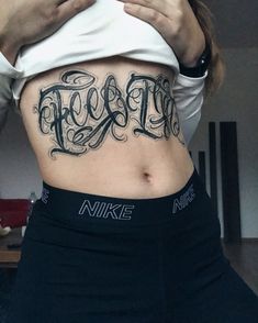 a woman with a tattoo on her stomach