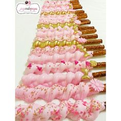 pink and gold donuts arranged in a pyramid