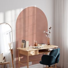 a room with a desk, chair and mirror in it that has an orange circle on the wall