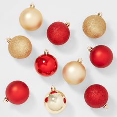 red and gold christmas ornaments arranged in a circle