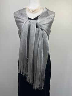 This versatile shimmery shiny shawl with fringe can be used to dress up an outfit for a special evening, a wedding or as a neck scarf in spring. Effortlessly give a dress a new look by simply adding this shawl. Perfect as bridesmaid gifts or wedding favours, the perfect gift for any occasion. This is not a very large shawl. There is metallic thread woven in the shawl that gives shining shimmery look.  Measures 20"Wx 75" The colours are very close however not exact. I tried to to capture the colo Elegant Fringe Shawl Scarf, Elegant Fringed Shawl Scarf, Elegant Summer Shawl With Fringe, Fringed Shawl For Party, Elegant Shawl For Summer Parties, Glamorous Party Shawl, Festive Shawl Scarf For Party, Festive Party Shawl Scarf, Evening Shawl Wrap Scarf