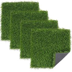 four pieces of artificial grass on a white background