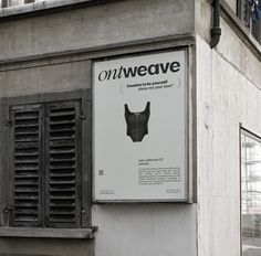 a sign on the side of a building that says onweave with an image of a woman's bra