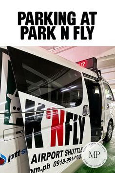 a van parked in a parking garage with the words parking at park n fly on it