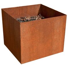 a square metal planter filled with dirt