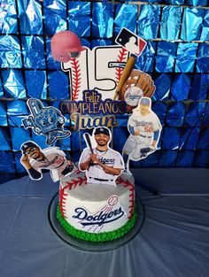 a baseball themed cake is displayed on a table