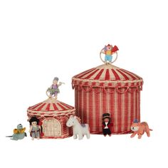 a toy circus set with figurines and toys in front of the tent, on a white background