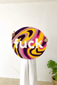 a woman holding up a sign with the word flick on it's face and hands