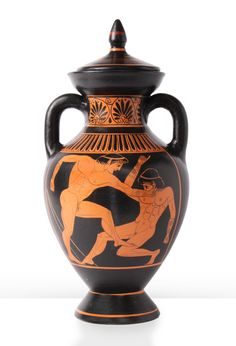 an orange and black vase with two men on it's sides, one holding the other