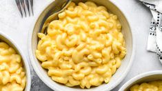 three bowls filled with macaroni and cheese