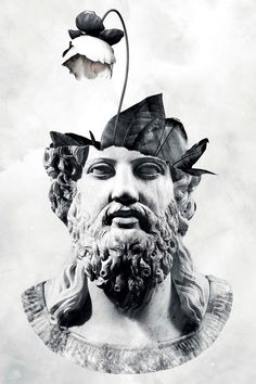 a black and white photo of a statue with a flower on it's head