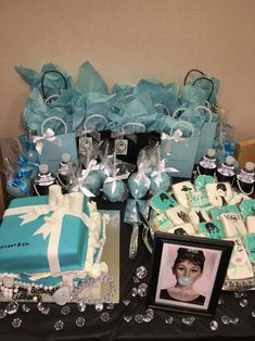 a table topped with blue and white cakes