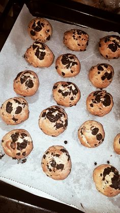 chocolate chip cookies on a baking sheet ready to be baked in the oven for consumption