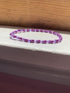 A bracelet with different colors of purple Dna Bracelet, Different Colors Of Purple, A Bracelet, Different Colors, Jewelry Bracelets, Beaded Bracelets, Ships, Bracelet, Purple