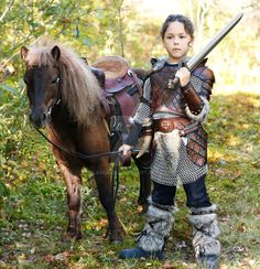 kid leather armor viking by Lagueuse child fighter barbarian knight squire horse pony armor clothes clothing fashion player character npc | Create your own roleplaying game material w/ RPG Bard: www.rpgbard.com | Writing inspiration for Dungeons and Dragons DND D&D Pathfinder PFRPG Warhammer 40k Star Wars Shadowrun Call of Cthulhu Lord of the Rings LoTR + d20 fantasy science fiction scifi horror design | Not Trusty Sword art: click artwork for source Viking Clothes, Norse Names, Kid Costume, Costume Viking, Viking Armor, Viking Costume, Horse Costumes, Female Armor, Leather Armor