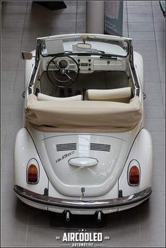 the interior of an old vw buggy is clean and ready to be driven