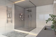 a bathroom with a shower, sink and towel rack on the wall next to it