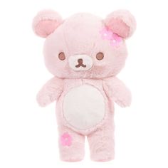 a pink teddy bear with flowers on its ears