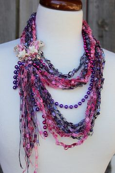 Four seasons infinity scarf is just what you need for a beautiful versatile accessory that can be worn year round! Hand crocheted with delicate sparkling shades of pink and purple ribbon yarn mixed with beads, butterfly and flowers, this one of a kind treasure can be worn long and short. Great with all kinds of outfits and styles: tank tops, blouses, t-shirts, dresses, over costs, turtlenecks, etc! Please see all pictures for more information. Beads Butterfly, Purple Hands, Ribbon Yarn, Purple Ribbon, Infinity Scarf, Hand Crochet, Four Seasons, Scarf Wrap, Pink Purple