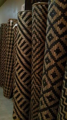 several black and white baskets are lined up on the floor