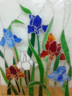 a stained glass panel with colorful flowers on it