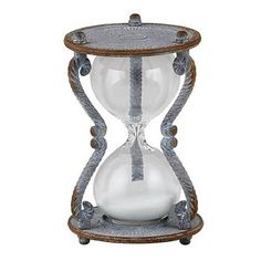 Keep track of time in a classic and stylish way with this Vintage Hour Glass!  This beautiful sandglass timer clock adds a rustic touch to any desktop decor. Let the gentle flow of sand remind you to take breaks and focus on what matters most.  Unique and stylish Functional Material: Metal/Glass Size: 4.5"L x 3"W x .5"H Care Instructions: Spot Clean Only By 47th & Main Color: Multicolor. Beautiful Kitchenware, Hourglasses, Timer Clock, Bronze Patina, Hour Glass, Desktop Decor, Turkish Towels, Classic Vintage, Rustic Charm