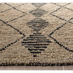 an area rug with black and white designs on it