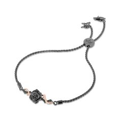 Darkness can't hide the beauty of this spellbinding diamond rose bolo bracelet from the Enchanted Disney Fine Jewelry Villains Collection inspired by Maleficent. Created in sterling silver with black rhodium plate and 10K rose gold, this intense look features an enhanced black diamond-touched bloom with a sandblasted matte texture. Thorny twists of rose gold and enhanced black diamond-lined vines highlight the center. Radiant with 1/6 ct. t.w. of diamonds and a brilliant buffed luster, this whea Enchanted Disney, Gold China, Enchanted Disney Fine Jewelry, Disney Fine Jewelry, Sweet Jewelry, Bolo Bracelet, Matte Texture, Disney Jewelry, Black Rhodium