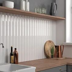 the kitchen counter is clean and ready to be used as a shelf above the sink