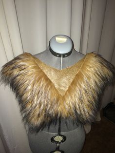 a mannequin with a fur collar on it