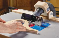 a man using a router to cut wood with a circular sawtoothing tool